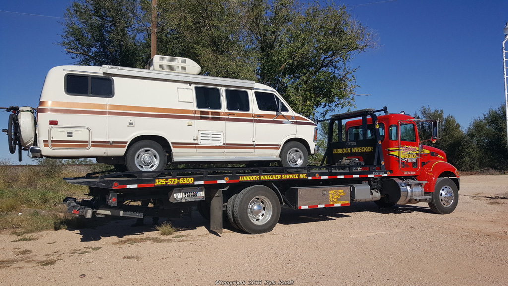 van-on-tow-truck