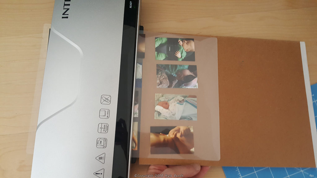 laminator being used to laminate the cutest baby pictures ever