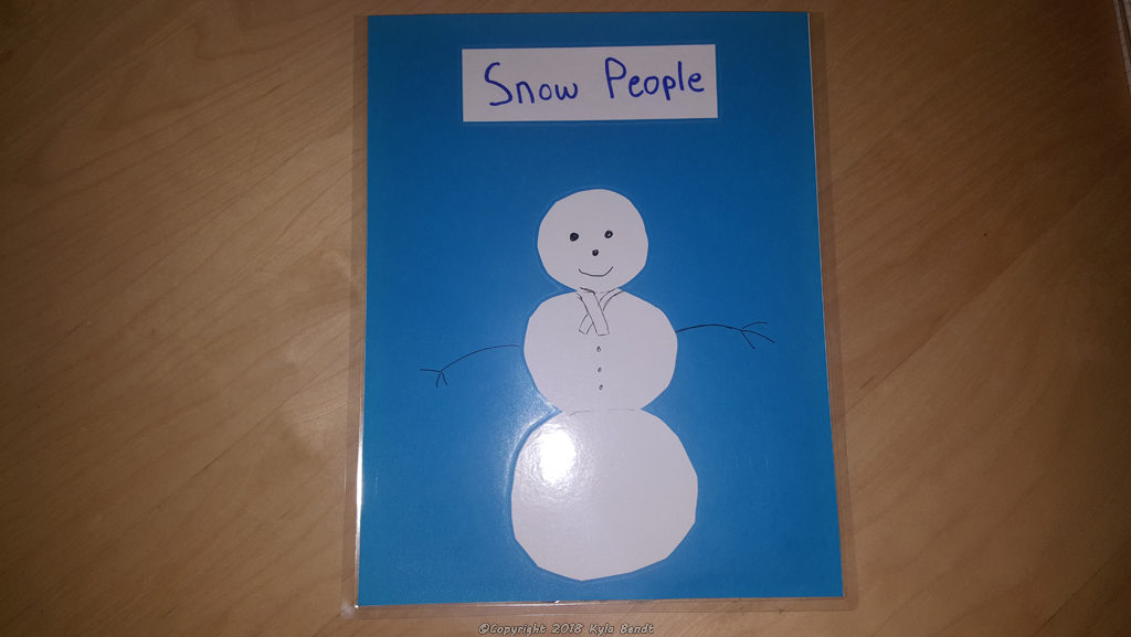 laminator project: laminated pouch for holding flat objects.  This one is blue, has a picture of a snowman and is labeled 'Snow People'