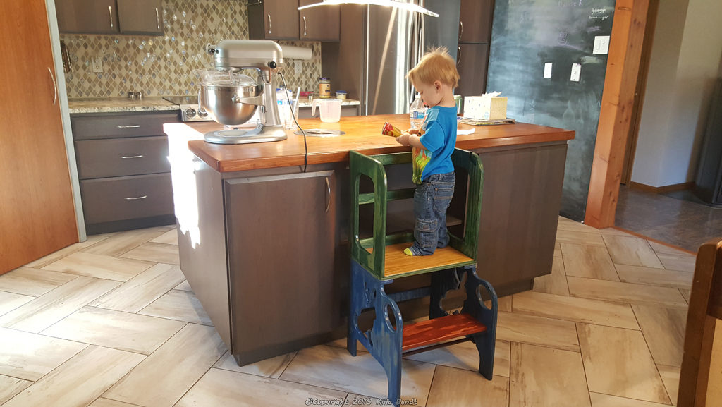 toddler on step stool