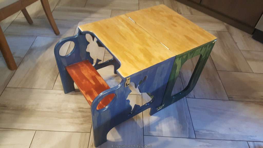 Convertible toddler step stool and table folded into table mode.