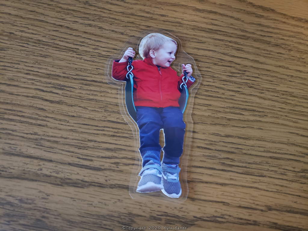 laminated child on swing image for making a christmas ornament